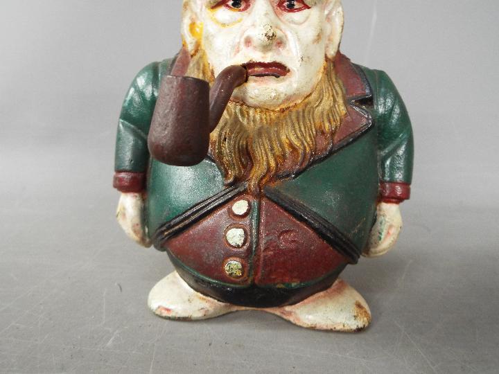 A cast iron 'Transvaal Money Box' in the form of a caricatured President Kruger, - Image 3 of 7