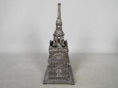 A vintage cast iron money bank in the form of Independence Hall Tower,