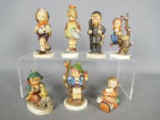 Seven Hummel figurines, largest approximately 12.5 cm (h).