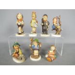 Seven Hummel figurines, largest approximately 12.5 cm (h).