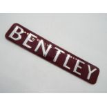 A red and chrome Bentley sign