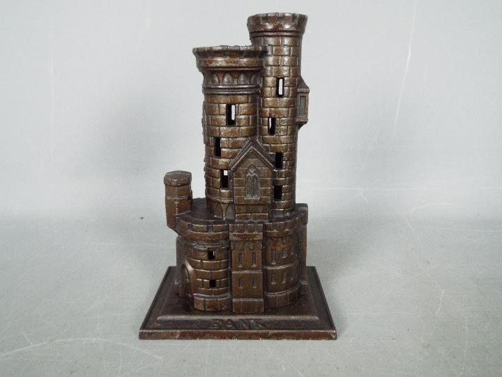 A cast iron, novelty money bank in the form of a castle, marked to the plinth 'Bank', - Image 3 of 6