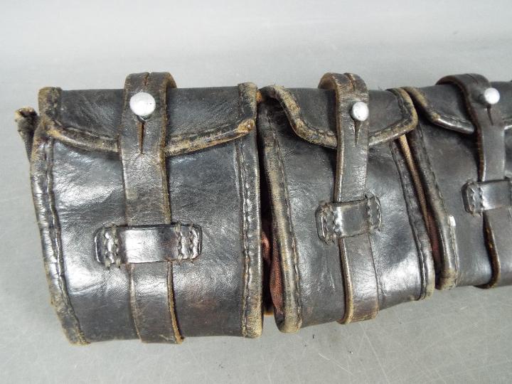 A vintage leather ammunition belt with five pouches. - Image 2 of 4