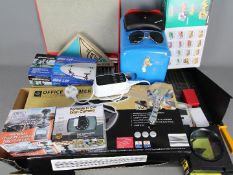 A mixed lot to include a mini fridge, boxed car dashboard cameras, sunglasses, boxed office trimmer,