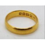 A 22ct gold wedding band, size O, approximately 4.8 grams all in.