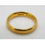 A 22ct gold wedding band, size I, approximately 4 grams all in.