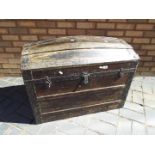 A metal bound dome top trunk, approximately 64 cm x 81 cm x 49 cm.