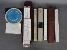 A small collection of slide rules and similar.