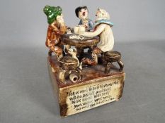 Runnaford Pottery - A Will Young 'Widecombe Fair' musical figural group of characters playing cards,