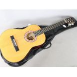 A Legend LEC8 children's acoustic guitar in soft carry case.