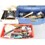 A toolbox containing a quantity of various hand tools and a boxed Elu router.