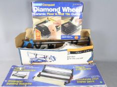 A Precision Mitre Box And Saw, Diamond Wheel Ceramic Tile Cutter and a Wallpaper Pasting Machine.