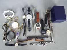 A collection of wristwatches and a yellow metal pocket watch.