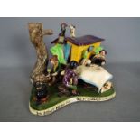 Runnaford Pottery - A Will Young 'Widecombe Fair' figural group 'Bill Brewer Has His Fortune Told