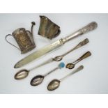 A small quantity of hallmarked silver spoons and tongs (66 grams all in), silver handled knife,