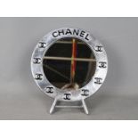 A round dressing table mirror,