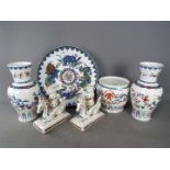 A collection of Franklin Mint Chinese porcelain comprising two baluster vases 'The Dance of the