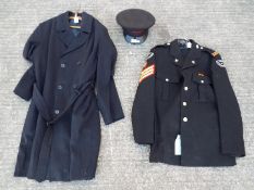 A Corps Of Commissionaires jacket by Hobson & Sons Ltd, an overcoat and a peaked cap.