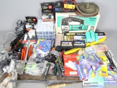 Various tools and accessories to include a boxed jigsaw, glue gun,