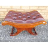 A good quality leather upholstered low stool.