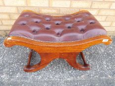 A good quality leather upholstered low stool.