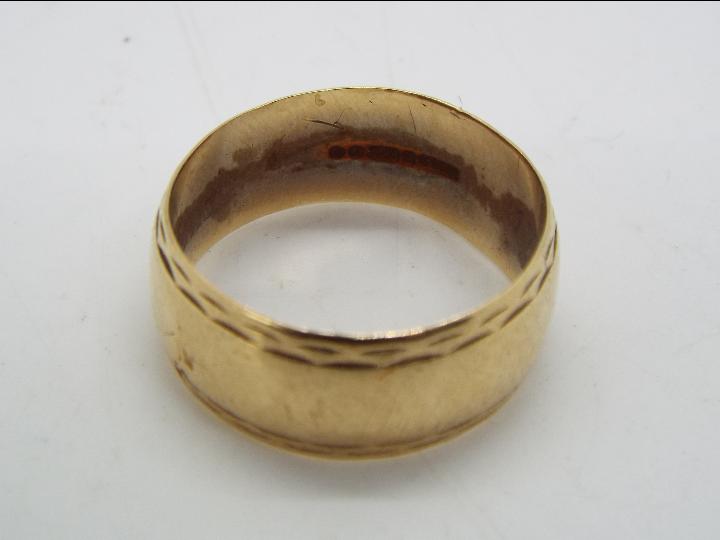 A 9ct gold wedding band, size T, approximately 5.5 grams all in. - Image 2 of 2