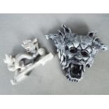 A Chinese soapstone dragon carving, 10 cm (h) and a wall mask.