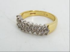 18ct gold - a 18 ct gold ring set with eighteen diamond, stamped .76, size N. approx weight 5.