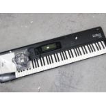 A Korg O1/W Pro keyboard synthesizer, with instruction manual.