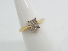 18ct gold - a 18 ct gold ring set with twelve princess cut diamonds, stamped 750, size N, approx 3.