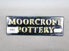 Moorcroft - A Moorcroft Pottery name plaque in the Sophie Christina pattern,