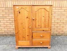 Small pine combination wardrobe, approximately 110 cm x 96 cm x 54 cm.