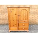 Small pine combination wardrobe, approximately 110 cm x 96 cm x 54 cm.