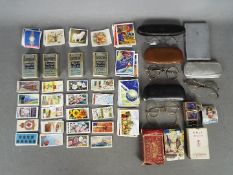 Lot to include cigarette cards, playing cards, vintage spectacles, cigarette case and similar.