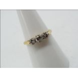 18ct gold - a 18 ct gold trilogy ring, set with diamonds, approx half a carrat size N,