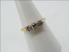 18ct gold - a 18 ct gold trilogy ring, set with diamonds, approx half a carrat size N,