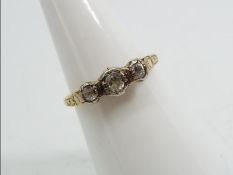 18ct gold - a 18ct gold trilogy ring set with old cut diamonds, size N, approx weight 2.
