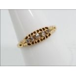 18ct gold - a 18 ct gold ring set with 5 diamonds, size T, approx weight 2.