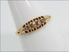 18ct gold - a 18 ct gold ring set with 5 diamonds, size T, approx weight 2.