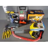 A selection of various tools to include a 5 in 1 air compressor, glue gun, hand saws and similar.