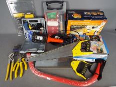 A selection of various tools to include a 5 in 1 air compressor, glue gun, hand saws and similar.
