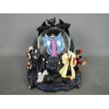 A large Disney 'Villains' snow globe depicting the antagonists from various Disney films,
