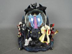 A large Disney 'Villains' snow globe depicting the antagonists from various Disney films,