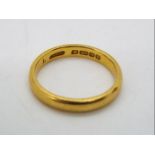 A 22ct gold wedding band, size M½, approximately 4.5 grams all in.