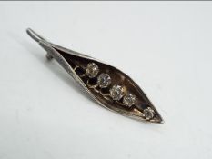 Arthur Johnson Smith - a AJS Silver hallmarked 'Lily of the Valley' brooch set with five Diamonte,