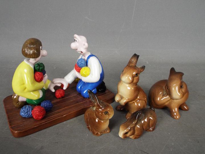 Four Beswick rabbit figurines,