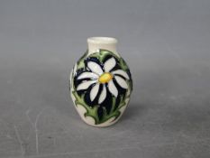 Moorcroft - a small trial vase by Moorcroft in the Daisy design,