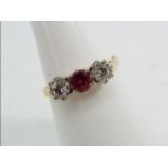 18ct gold platinum - a 18 ct gold platinum trilogy ring, stone set with Ruby and Diamonds, size N,