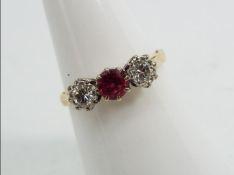 18ct gold platinum - a 18 ct gold platinum trilogy ring, stone set with Ruby and Diamonds, size N,
