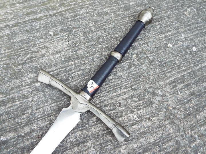A replica two-handed broad sword with metal pommel and cross-guard, faux leather handle, - Image 2 of 5